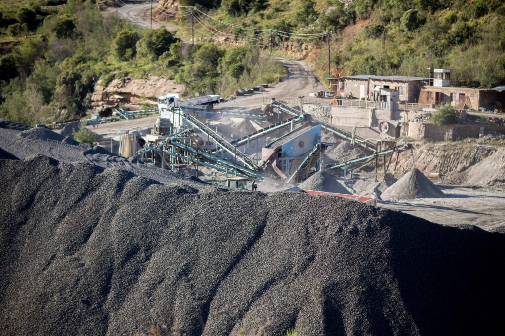 A conveyor belt carrying gravel at a mining operation